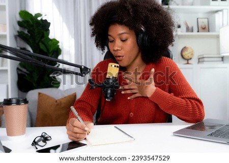 Host channel of African woman influencer talk and write story telling of listener in broadcast studio. Time slot of life coach consultant on social media online. Concept of giving advice. Tastemaker.