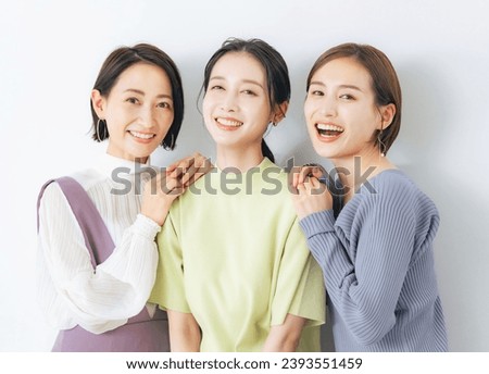 Portrait of group of middle aged Asian women with colorful clothes. Skin care. Cosmetics. Anti-aging. Royalty-Free Stock Photo #2393551459