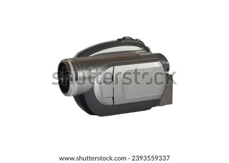 Vintage digital movie camera with recording on small DVDs with with background.