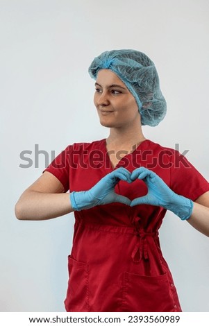 Young female doctor in labcoat looking at camera isolated, studio shhot. Medical personal. Healthcare