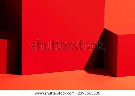 Red cubes on red background. Geometric background.