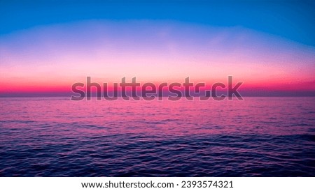 A picture of a sea with a twilight sky