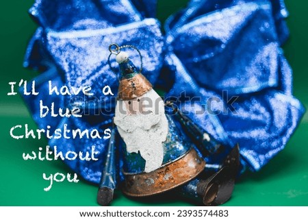 A holiday message I’ll have a blue Christmas without you with photo illustration image of Santa and a green background