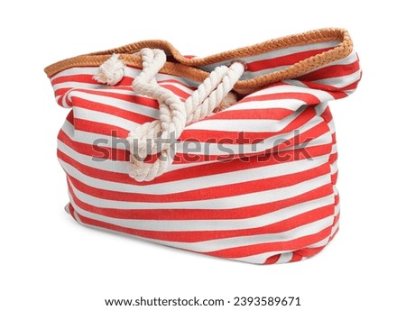 Stylish red striped bag isolated on white. Beach object