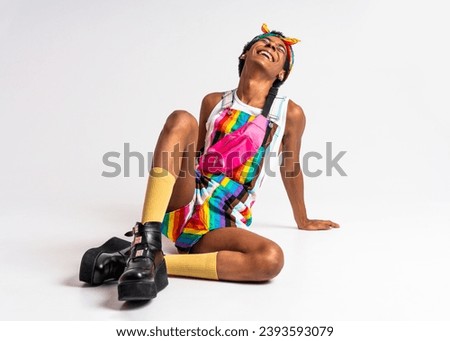 Fluid gender non binary hispanic  man posing in studio with fashionable clothing - concepts about LGBTQ, genderless and diversity