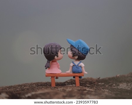 Toy couples sitting on bench, Romantic  couple miniature toys.