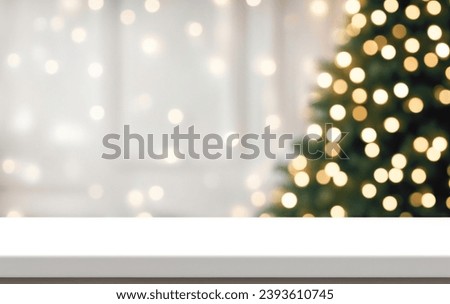 White empty table top in front, blurred christmas tree background. Xmas celebration banner with empty space. White holiday backdrop with golden bokeh lights. Happy New Year scene
