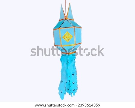 The white background in the picture is a lantern made of bamboo and blue paper decorated with a gold-lined border. Candles are lit in the lanterns used to decorate the Thai Loy Krathong Festival durin
