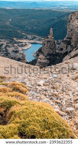 Wild Horizon: Boron's Rocky Trail Above Vadiello Reservoir's Barren Beauty, A Pyrenean Wilderness Ascent Through Rugged Realms of Nature's Majesty.

 Royalty-Free Stock Photo #2393622355