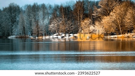 Beautiful winter on the river bank Royalty-Free Stock Photo #2393622527