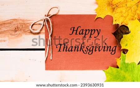 Invitation happy thaksgiving, a brown board in the background, leaves of autumn, holidays decoration concept. Royalty-Free Stock Photo #2393630931