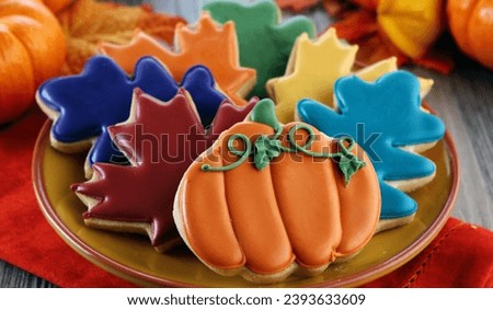 Thanksgiving designed cookies in a brown dish, decoration holidays concept. Royalty-Free Stock Photo #2393633609
