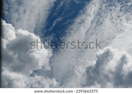 A gap in the clouds through which the blue sky is visible