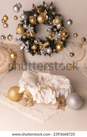 New Year's decor. Decor for the New Year. New Year's photo shoot for a newborn. Photo zone for a newborn with New Year's decor. Christmas wreath on the wall.