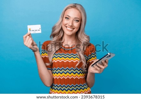 Photo of pretty adorable girl dressed print shirt online shopping modern device isolated blue color background