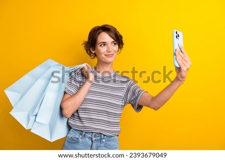 Photo of lovely cute girl dressed trendy clothes recording video call talk isolated on yellow color background