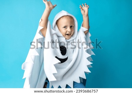Funny Halloween Kid Concept or April Fool's joke, little cute child with white dressed costume.