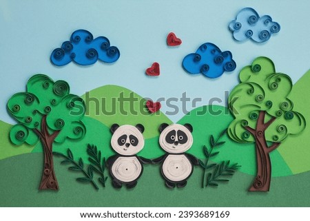 Cute couple panda in love with hearts. Two funny pandas quilling character in field, near trees in summer day with clouds. Happy cute panda fall in love. Hand made of paper quilling technique.