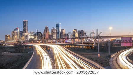 Houston, Texas, USA downtown skyline over the highways at dusk. Royalty-Free Stock Photo #2393692857
