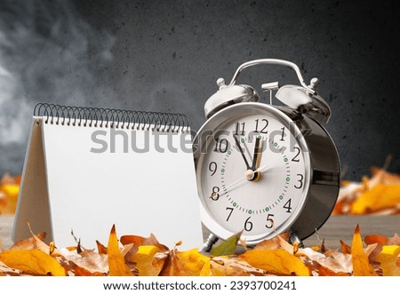 October 2023 calendar and autumn leaf decoration