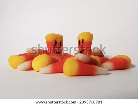 Candy Corn with Faces look at each other