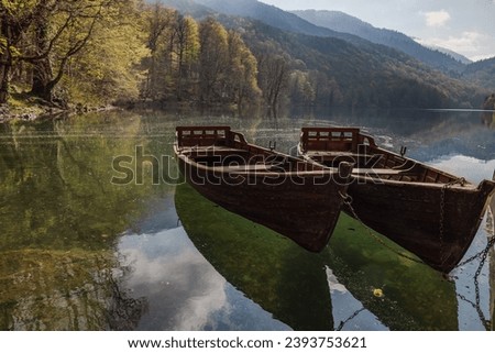 Boats on the clear water of Biogradasko Lake in Biogradaska Gora National Park in Montenegro Royalty-Free Stock Photo #2393753621
