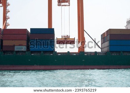 crane loading cargo container from truck to container ship in the international terminal logistic sea port concept freight shipping by ship, webinar banner forwarder mast	