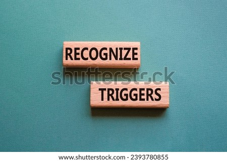 Recognize triggers symbol. Concept words Recognize triggers on wooden blocks. Beautiful grey green background. Business and Recognize triggers concept. Copy space. Royalty-Free Stock Photo #2393780855