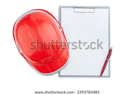 Red Construction Helmet On Clipboard And Ballpoint Pen Isolated Royalty-Free Stock Photo #2393783485