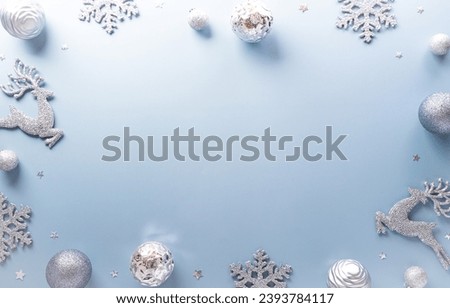 Christmas and new year background concept. Top view of Christmas star and snowflake on pastel blue background.
