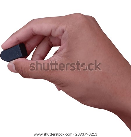 Brown asian hand holding eraser ready to erase from point of view isolated