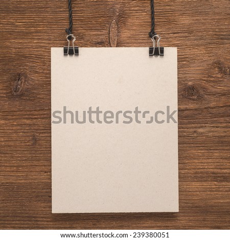 Paper signboard on wooden background  
