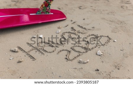Hawaii 2023 handwritten in the sand surface