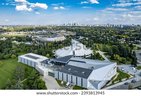 Aerial views of Telus World of Science and Hemingway Recreation Centre under construction with Edmonton skyline in the background