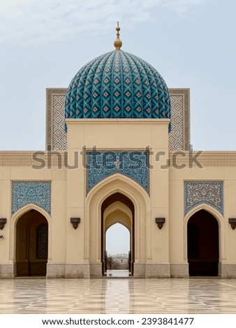 Symmetrical shot of Sultan Qaboos Grand Mosque in Sohar. Showing the beauty of Islamic architecture.  Royalty-Free Stock Photo #2393841477