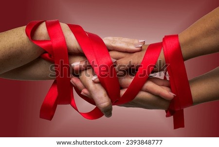 Hands unite, adorned with the iconic red ribbon, solidarity for World AIDS Day. A powerful concept promoting awareness, compassion, and global unity. Health campaigns. Healthcare and medicine concept.