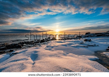 The coast of the Gulf of Finland in winter at sunset Royalty-Free Stock Photo #2393890971