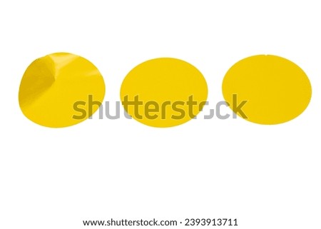 Round yellow stickers, blank tags labels isolated on a white background. Top view. 