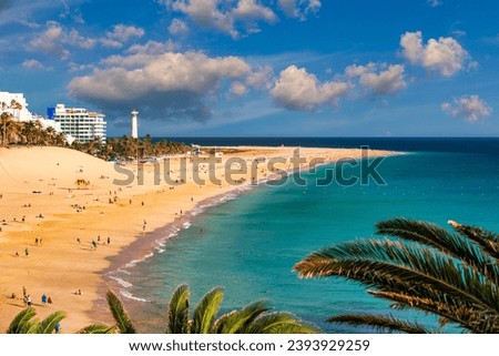 Morro Jable, Fuerteventura, Spain. Breathtaking beach Playa del Matorral in the rays of the sunset. Morro Jable and Playa del Matorral, Fuerteventura, Canary Islands, Spain, Atlantic, Europe Royalty-Free Stock Photo #2393929259