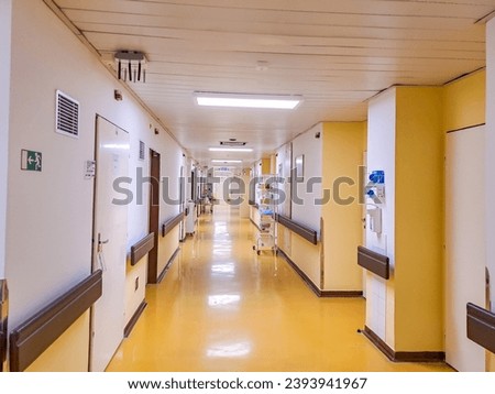 Long hospital bright corridor with rooms. Empty modern hospital corridor. Prague Royalty-Free Stock Photo #2393941967