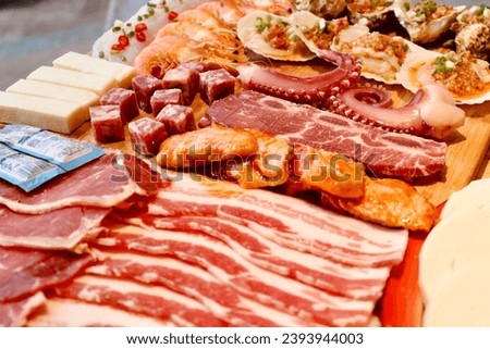 A closeup shot of delicious meat assortiment with cheese and snacks Royalty-Free Stock Photo #2393944003