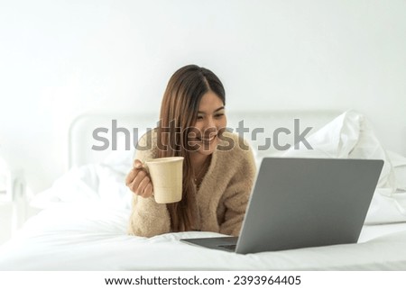 Young smiling asian woman happy relax use laptop conference work,learning, education, shopping, study online, webinar, online marketing, business, blog, digital internet advertising at home