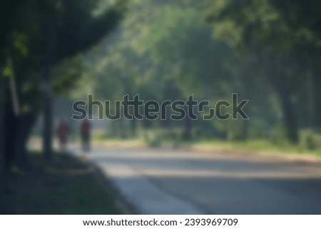 Blurred background of people walking in the park, bokeh