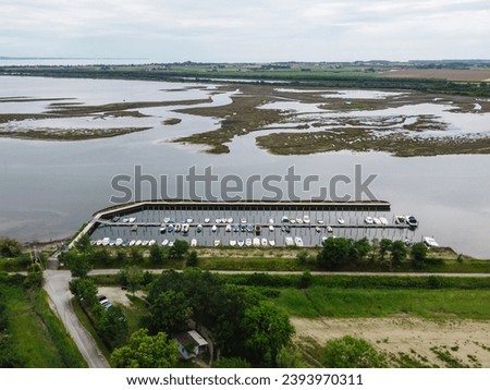 Small coastal boat harbor from above. Landscape of the sea.