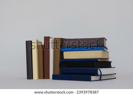 Stack of books on white background education school