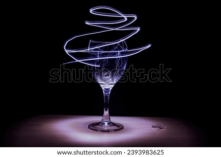 Abstract and random light painting of a broken wine glass. Meaning up to the interpreter. 