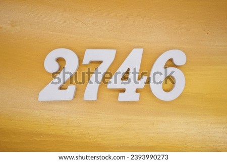 The golden yellow painted wood panel for the background, number 2746, is made from white painted wood.