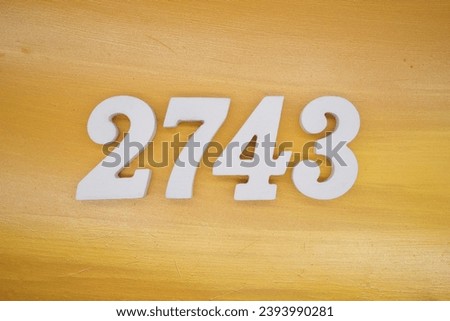 The golden yellow painted wood panel for the background, number 2743, is made from white painted wood.