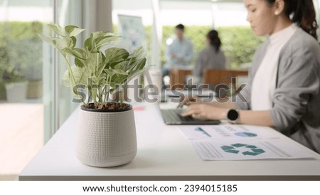 Save the planet earth of Future growth Net zero waste ESG office global protect CO2 credit emission social issues project. Asia people woman teamwork teaching advice Eco friendly SDGs job on laptop. Royalty-Free Stock Photo #2394015185