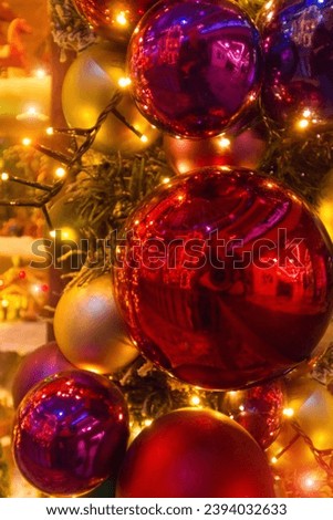 Christmas red and gold balls all with lights and bulbs lights on the Christmas tree, Christmas card.